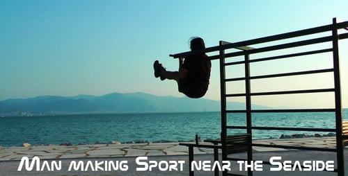 Man Doing Knee Raises on Beach Exercise Equipment