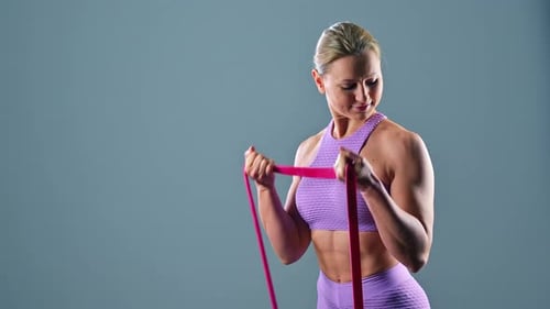 Woman Exercising with Resistance Band