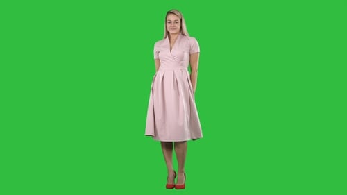Beautiful lady in pink dress preen on a Green Screen, Chroma Key. Beautiful lady in pink dress preen on a Green Screen, Chroma Key.