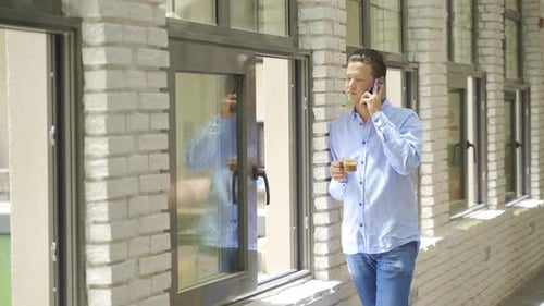 Talking on the phone in the cafe.