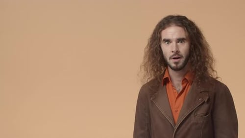 Man Looks Surprised and Points to the Side