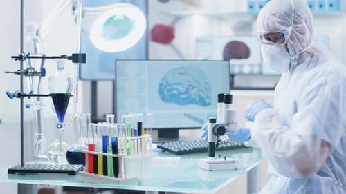 Male Scientist Researcher Working in a Secure High End Laboratory