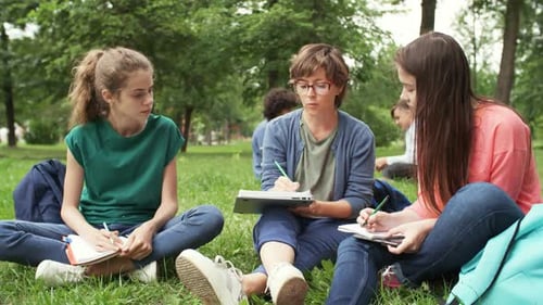 Two Schoolgirls with Teacher on Outdoor Lesson