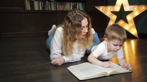 Mother and Child Reading Together in Cozy Home