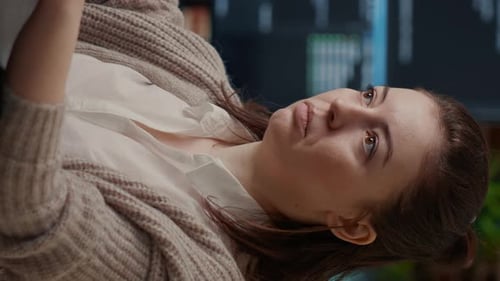 Young Woman Programming Software Code in Office Setting