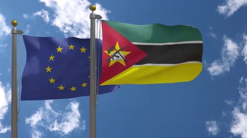 European Union and Mozambique Flags Waving in the Wind