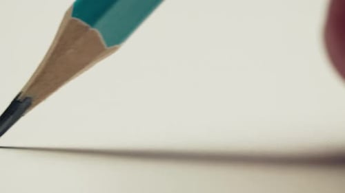Pencil Draws a Straight Black Line on Paper