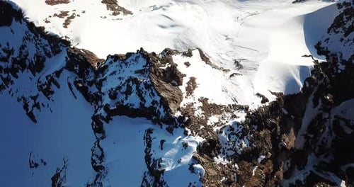 Rocky Mountain Peaks Covered with Snow. Shooting from A Drone, Top View