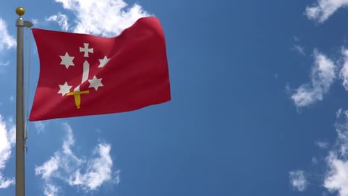 Red Flag with Sword and Cross Emblem Waving in Blue Sky