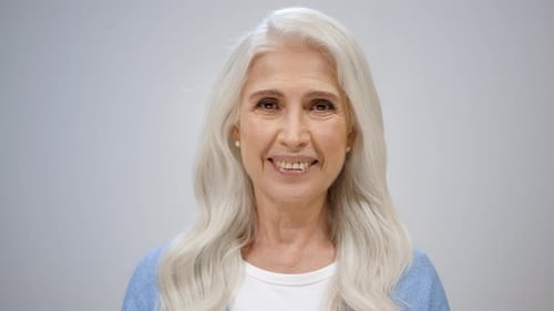 Cheerful Senior Woman Looking Happy in Studio