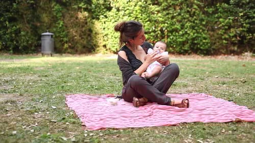 Mother with her baby daughter at park spending some quality time together