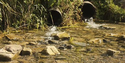 Spring Water Flowing Out Of Pipes