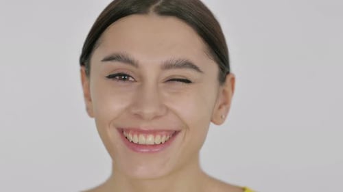 Face of Spanish Woman Winking at the Camera