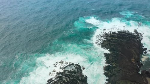 Drone Footage of Picturesque Shore Washed By the Foamy Waves of the Ocean