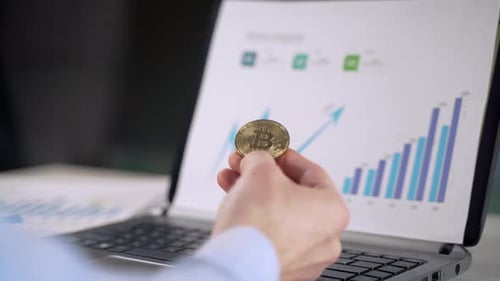 Bitcoin in the hands of a businessman. Symbol of cryptocurrency