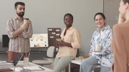 Diverse Colleagues Having Coffee Break in Office