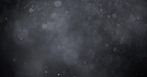 Floating White Particles on Dark Abstract Background