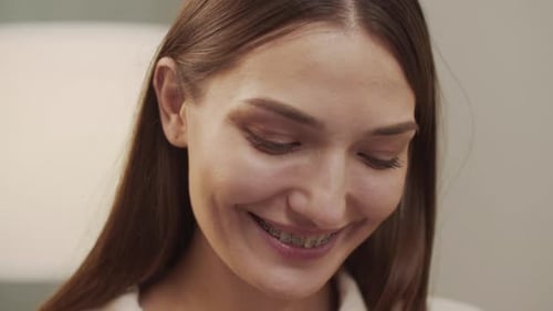 Smiling Young Woman with Braces Close-Up