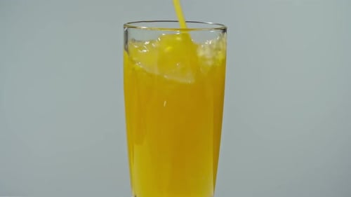 Pouring Orange Juice into a Glass