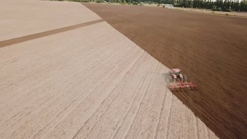 Tractor Plows a Field