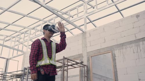 Construction Engineer Uses VR Headset on Building Site