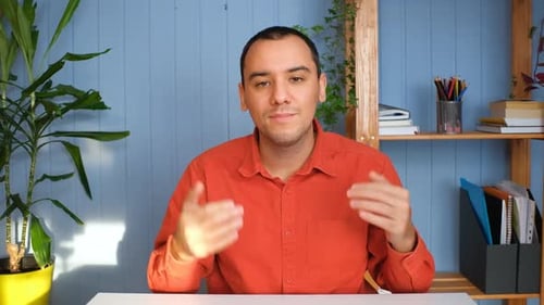 Young Adult Explaining Information with Hand Gestures