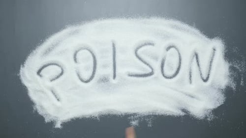 Mot poison écrit sur du sucre.