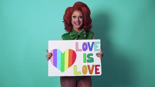 Drag Queen Holding a Love is Love Sign