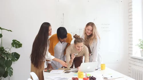 Team of Young Adults Collaborating in an Office