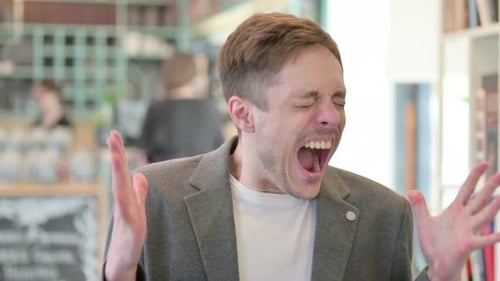 Man in Jacket Yelling in Workplace Setting
