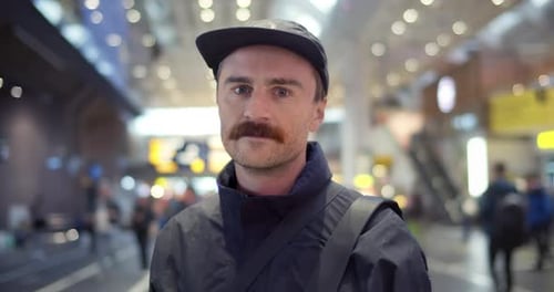 Man Smiling in Urban Terminal