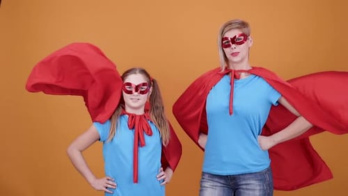 Mother and Daughter as Superheros with Capes