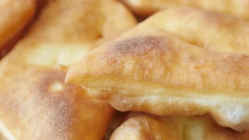 Tasty fried buns made in hot oil served on plate 3840X2160 UltraHD footage - Close-up of golden pir