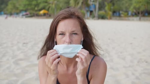 Woman Wearing a Medical Mask on Her Face