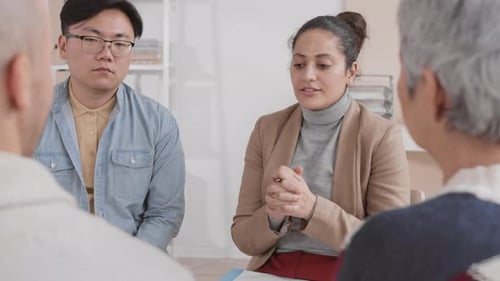 Diverse Adults in an Office Group Meeting