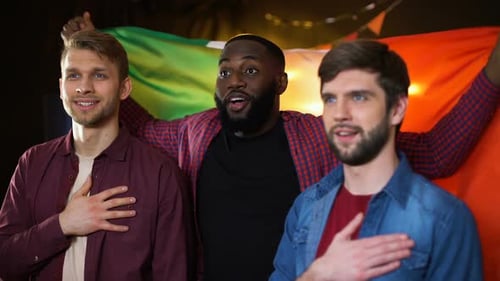 Men Holding Flag with Hands on Heart