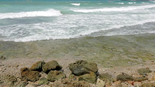 Sea Waves break over stone