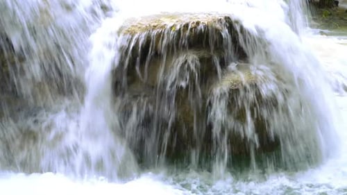 Water Cascading Over a Rocky Waterfall Formation