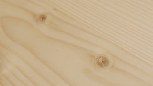 Knots inside wood board structure close-up 4K footage