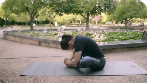 Asian woman exercise in park outdoor with new normal in COVID-19 situation