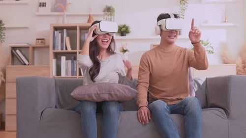 Young Couple Enjoys Virtual Reality at Home