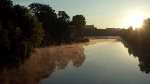 Beautiful morning, summer flight over the river, Fog, trees