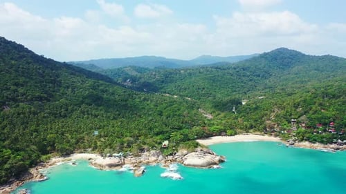 Tropical above island view of a sunshine white sandy paradise beach and turquoise sea background in