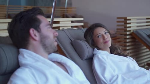 A man and woman couple relaxing at a luxury spa resort