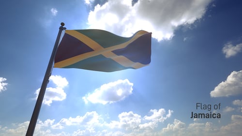 Jamaica National Flag Waving in Sunlit Blue Sky