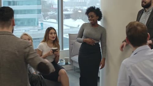 Diverse Team Discussing Ideas in Modern Office