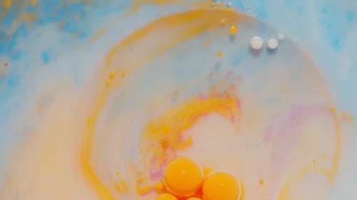 Ink Bubbles Mixed with Liquid Substance of Oil Milk Soap Bright Acrylic Paint on Colorful Surface