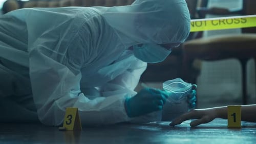 Crime Scene Investigator Collects Evidence Indoors