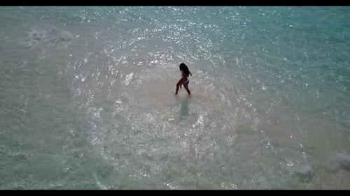 Female model happy and smiling on paradise seashore beach journey by clear lagoon and white sand bac