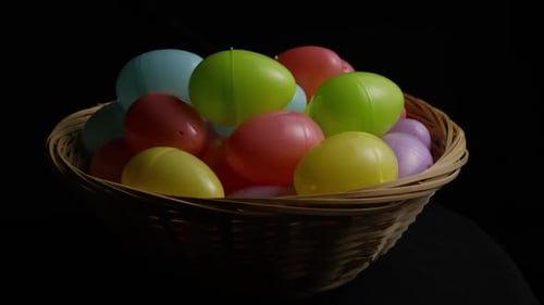 Colorful Easter Eggs in a Woven Basket